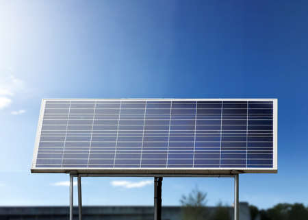 Photovoltaic or solar cell panels with landscape background, sustainable energy concept.