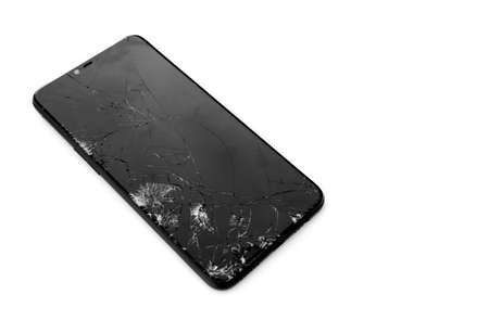 Brocken mirror film of touch screen mobile phone on white background, soft and selective focus on...