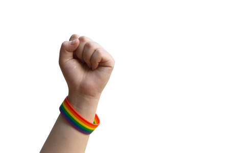 Isolated human left fist with rainbow wristband, clipping paths.の写真素材