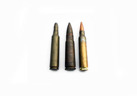 isolated old ak and m16 bullets on white background, soft and selective focus.