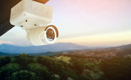 Mini cctv cameras installed on the wall outside the house to record and to do security at home when...