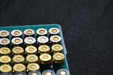 9mm bullet plastic box on dark background, soft and selective focus.の写真素材