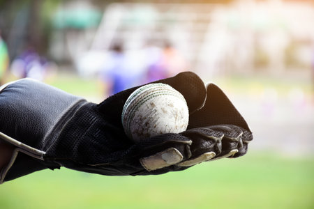Old leather cricket balls for training and practising on sand floor beside the court, soft and...