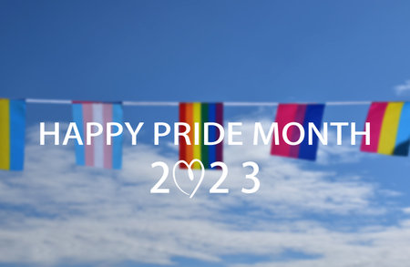 'HAPPY PRiDE MONTH 2023' on bluesky and rainbow flags background, concept for lgbtq+ celebrations in pride month, june, 2023.の写真素材