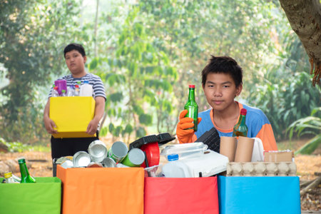 Volunteers are collecting garbage in the park, recycle concept.の写真素材