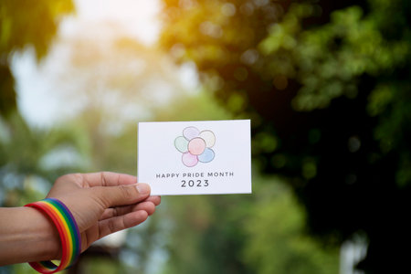 Woman hand holding a paper card with happy new year 2017 text.の写真素材