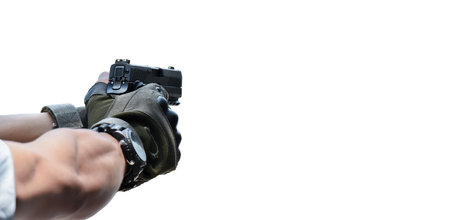 Man hand holding a gun isolated on white background. Focus on gun.の写真素材