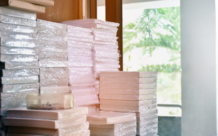 A pile of new receipt documents for use as evidence for paying tuition fees at a school, sunlight edited, soft and selective focus.の写真素材