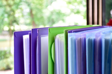 Back view of various plastic file folders for storing important documents in a file box for neatness...