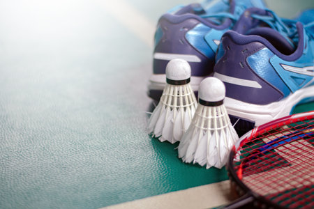 Badminton racket and shuttlecock on green court. Sport backgroundの写真素材