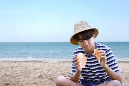 Young man at the beach, summer vacation concept.の写真素材