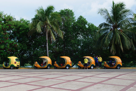 Several Coco taxi in the parking with tourist.  VARADERO CUBA - 29 August 2015.のeditorial素材