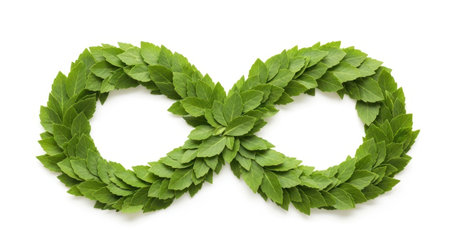 An infinity symbol crafted from vibrant green leaves. This symbolizes endlessness, nature's cycle, and organic growth presented on a clean backdrop for versatility.の素材