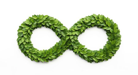 An infinity symbol crafted from lush green leaves, representing endless cycles, growth, and nature's persistent beauty. This organic design is set against a clean backdrop for focus.の素材