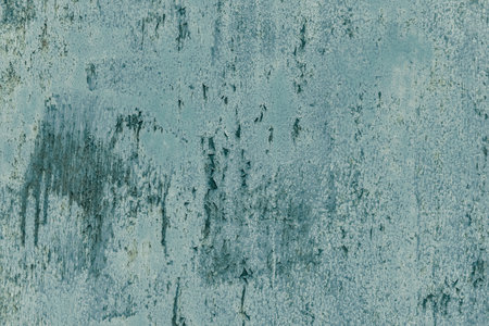 Rusty metal painted background. Rust spots and streaks on stained metal surface. Grunge industrial colored steel texture. Scratched corroded aged damaged backdrop with rustic vintage worn details.の写真素材