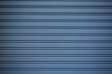 Textured shutter steel door background.