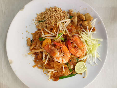 Pad thai with shrimp is a thai street foodの写真素材