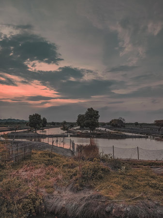 Sunset over the river in the countrysideの写真素材
