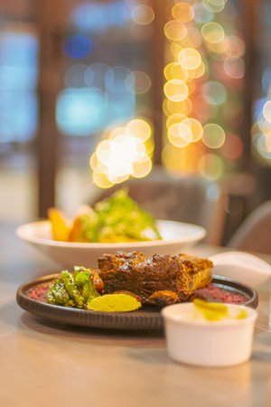 Beef steak with salad and sauce in restaurant - Vintage Light Filter