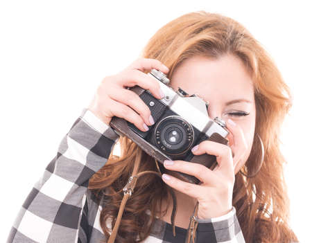close up of YOUNG GIRL IS SHOOTING WITHA A RETRO CAMERA