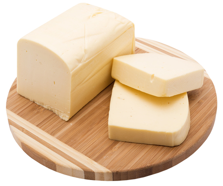 yellow cheece on wooden plank. isolated on white background.の写真素材