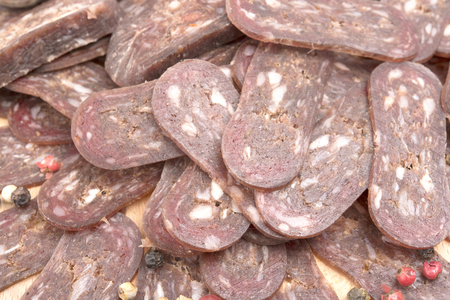sliced lukanka salami backgroundの写真素材
