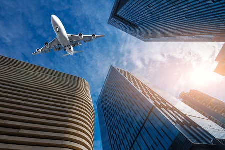 Shanghai's skyscrapers and airplanes on skyの写真素材