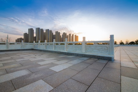 Empty floor and modern building with sunbeamの写真素材