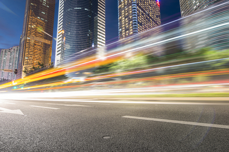 the light trails on the modern building background in guangzhou china.の写真素材