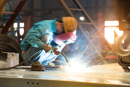 Worker welding the steel structureの写真素材