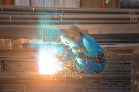 An industrial background. Welder in a factoryの写真素材