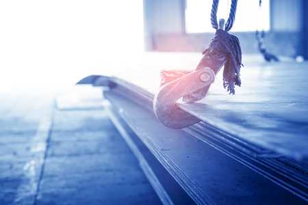 empty warehouse interior with crane hookの写真素材