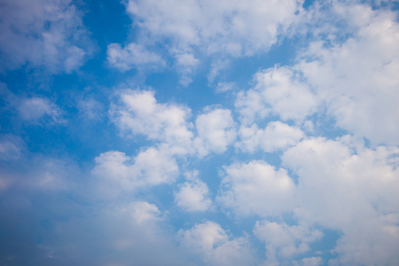 Blue sky with clouds and sun.の写真素材