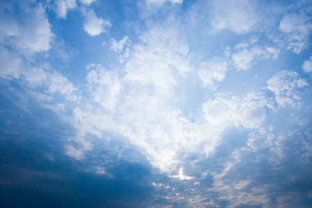 Blue sky with clouds and sun.の写真素材