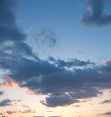 Blue sky with clouds and sun reflection in water with place for your textの写真素材