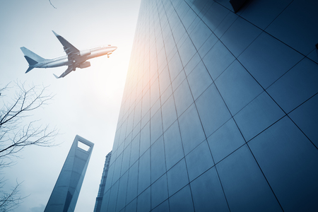 Shanghai's skyscrapers and airplanes on skyのeditorial素材