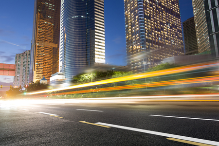 the light trails on the modern building background in shanghai china.の写真素材
