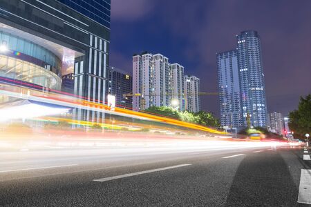 the light trails on the modern building background in shanghai china.の写真素材