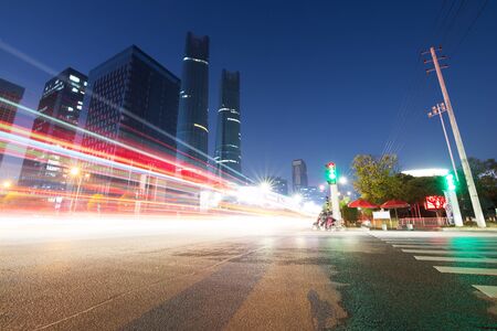 the light trails on the modern building background in shanghai china.の写真素材