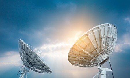 In the city night background large satellite antennaの写真素材