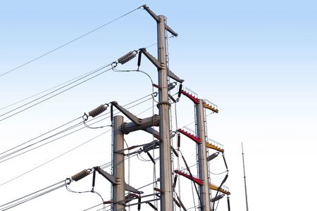 Electrical poles of high voltage in white cloud and blue sky.の写真素材