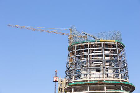 Construction site with cranes on sky backgroundのeditorial素材
