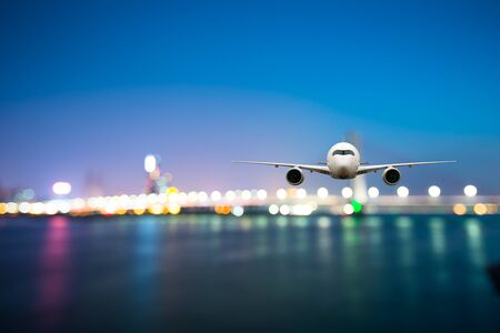 perspective view of jet airliner in flight with bokeh backgroundの写真素材