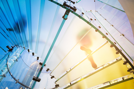 Modern Glass Staircase Silhouette of walking People in shanghai china.のeditorial素材