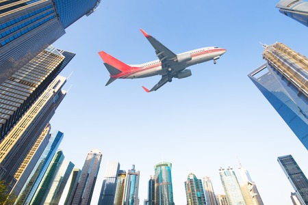aircraft with shanghai skyline of the lujiazui financial center