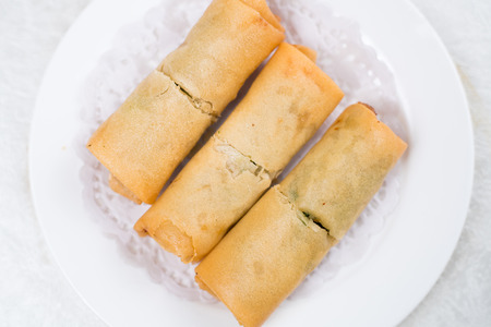 Spring Roll also known as Egg Roll isolated on white.の写真素材