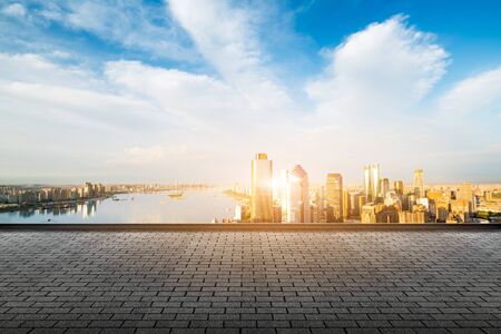 empty marble floor with cityscape and skyline in cloud skyの写真素材