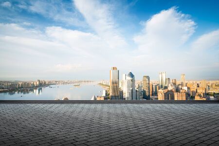 empty marble floor with cityscape and skyline in cloud skyの写真素材