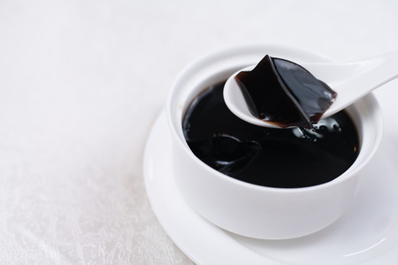 Grass jelly It's Southeast Asia Dessert made from made by boiling the aged and slightly oxidized stalks.の写真素材