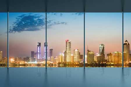 A bird's eye view of the city night view outside the windowの写真素材